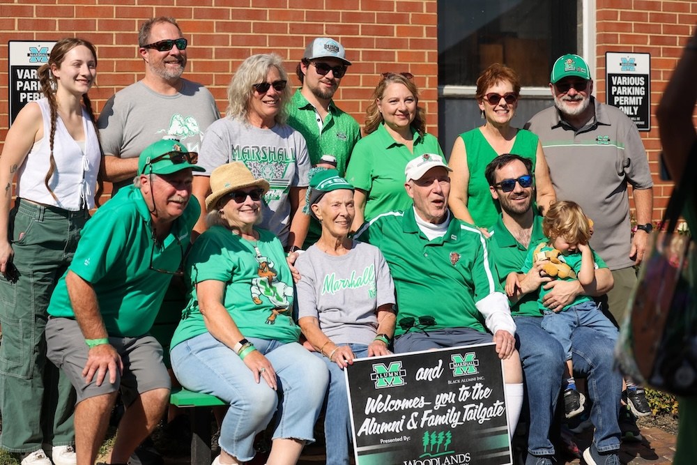 Members of the Woodlands Alumni Chapter come together with friends and family during the Alumni Association's annual Homecoming tailgate in October 2025.