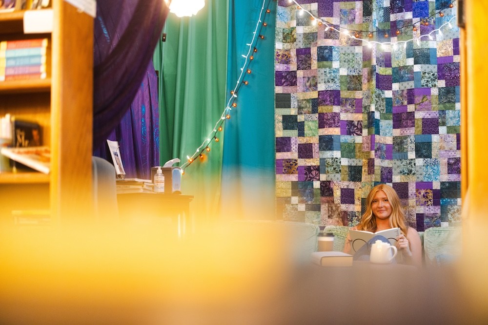 Courtney Burgess enjoys the ambience of this cozy spot at Cicada Books, her favorite place to spend quiet time off campus.